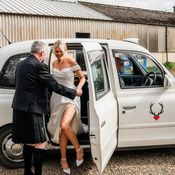 hannah and euan arriving at wedding