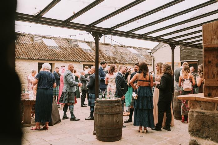 people celebrating covered corutyard cardney steading