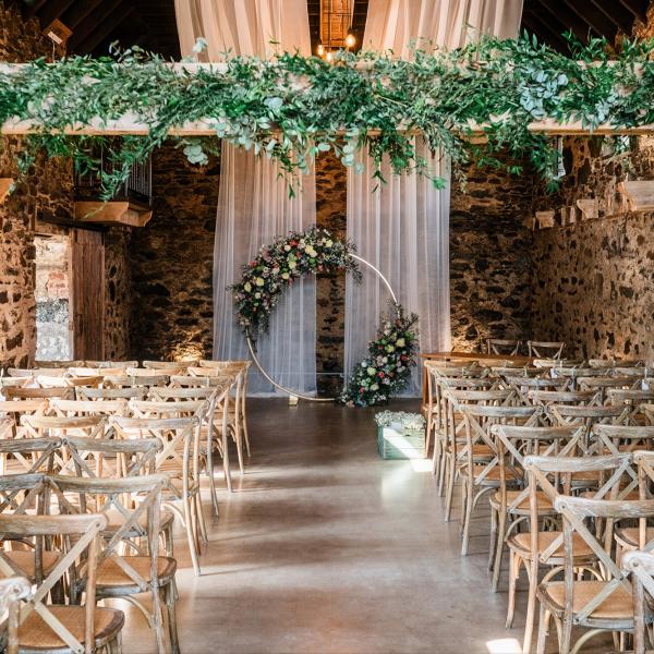 chairand decorations in rustic barn mill wedding venue