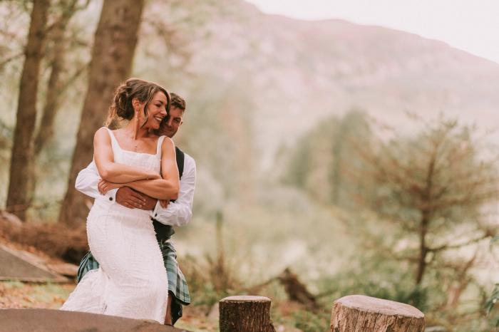 Fire pit woodland wedding couple outside Cardney Steading Venue