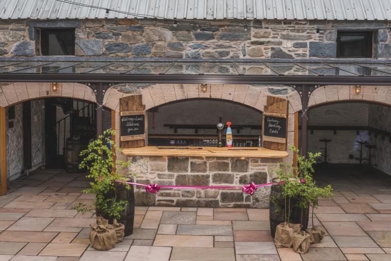 Outdoor drinks reception in Cardney Steading courtyard